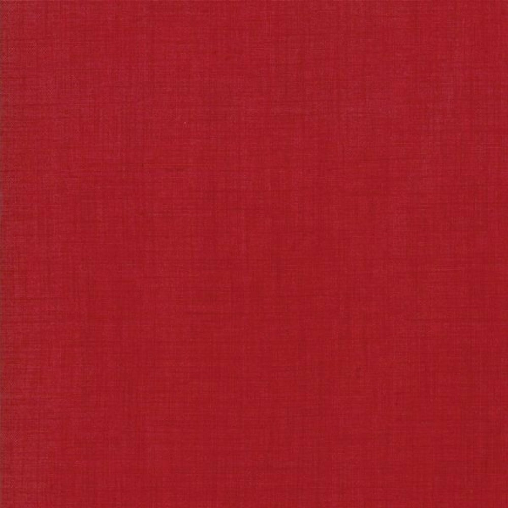 A solid red piece of fabric, for use as a blender for quilting, made of cotton material.