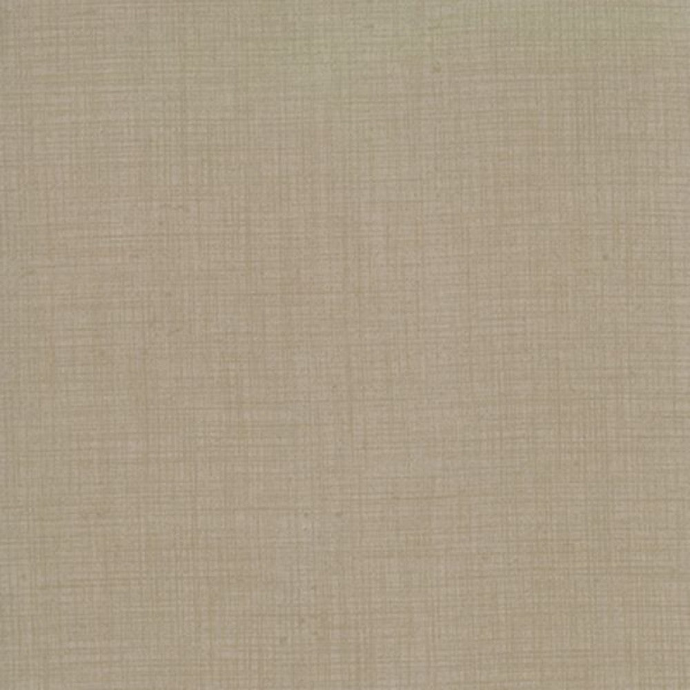 A textured khaki fabric blender, used for quilting.