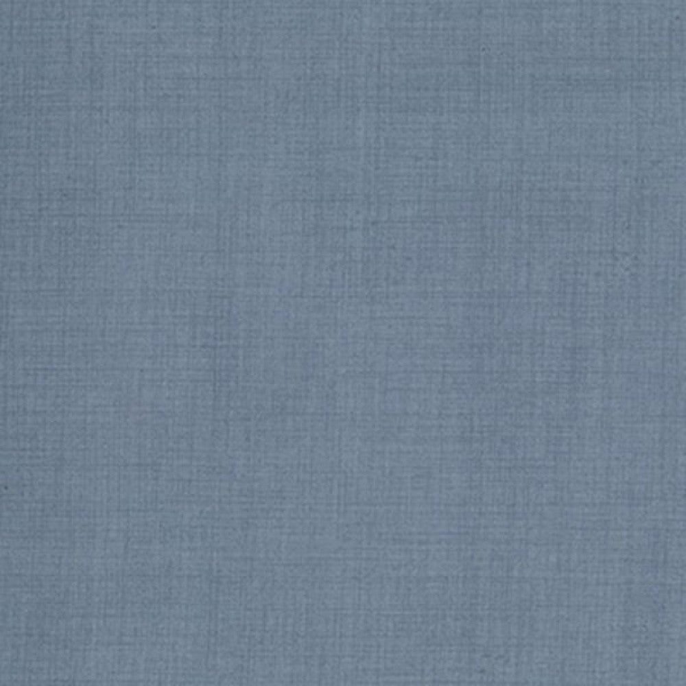 A solid blue fabric swatch for use in a quilt as a blender.