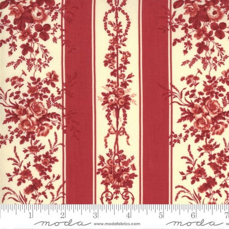 A swatch of fabric from the Jardin De Fleurs collection with a floral design in red and white colors.