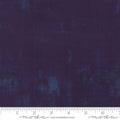 A swatch of textured purple quilt fabric swatch.