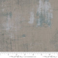 A swatch of grey cotton quilting fabric with a textured design.