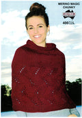 A person wearing a red knitted capelet with a cable design.