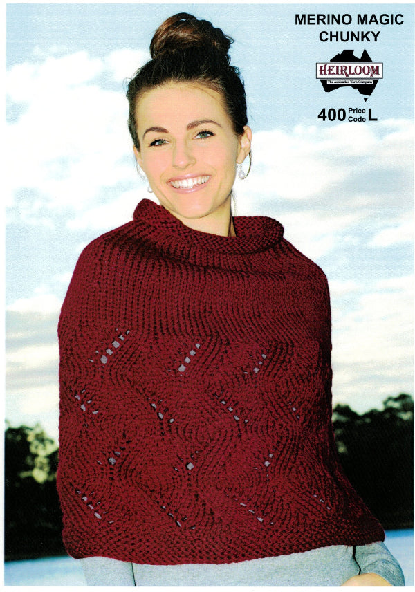 A person wearing a red knitted capelet with a cable design.