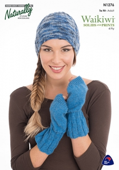 A woman wearing a blue knitted hat and fingerless gloves, which are designed to be knitted using a Naturally Knitting pattern.