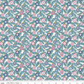 A Liberty of London quilting fabric with a Christmas-themed design featuring various festive motifs in pinks and turquoise on a white background.