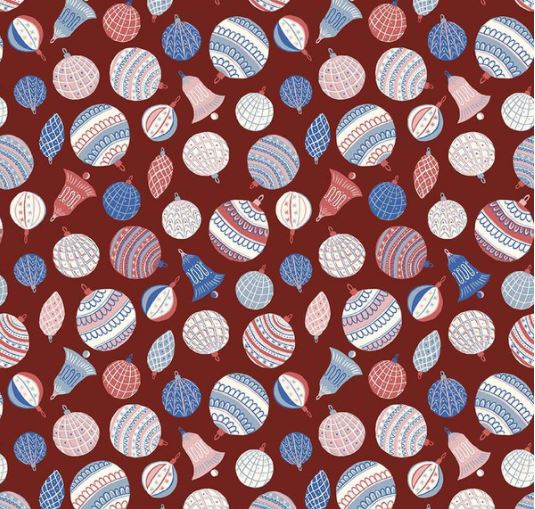 A Quilt fabric from Liberty of London with a Christmas theme, featuring baubles and festive designs on a red background.