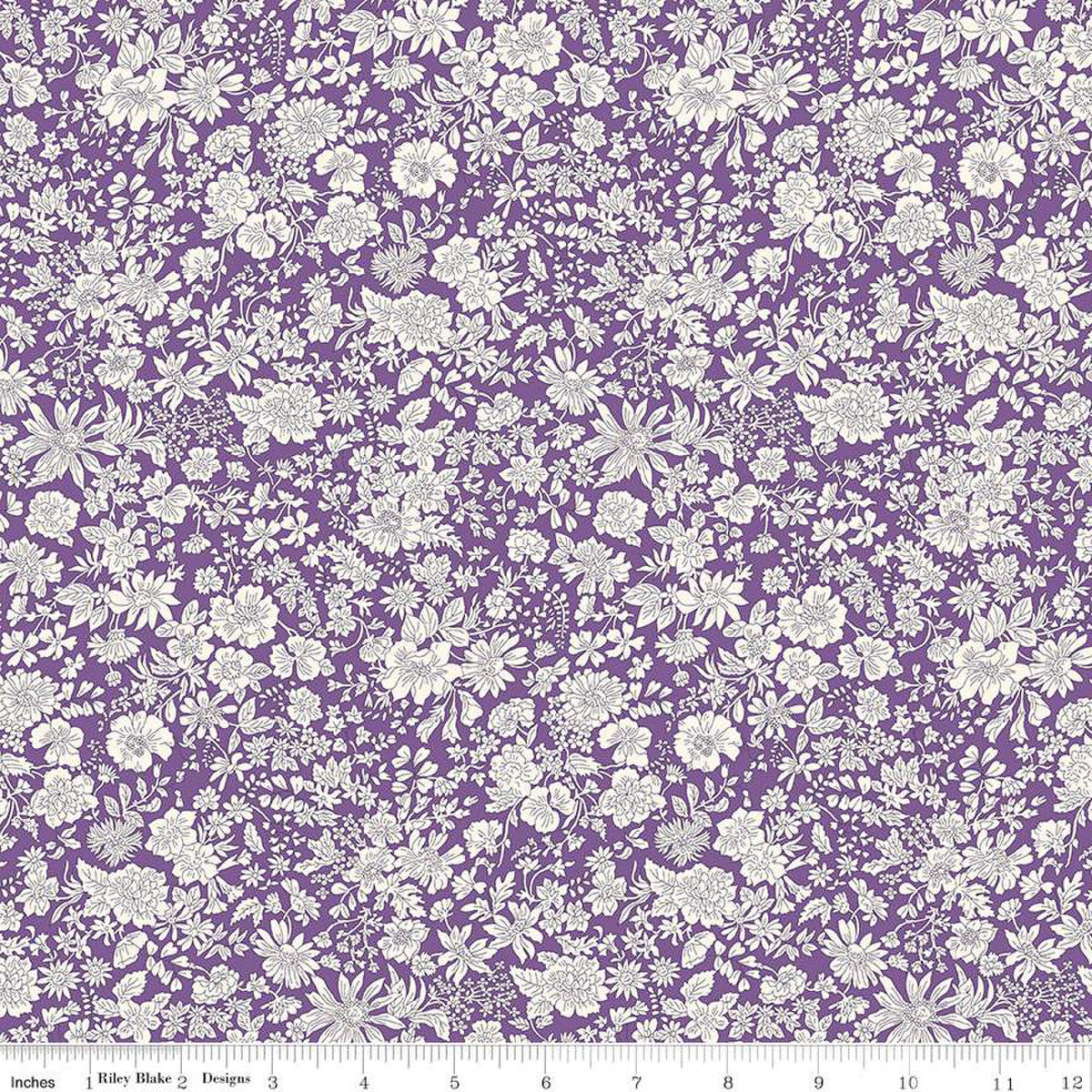 A quilting fabric from the Liberty Fabrics Emily Belle Collection featuring a purple background with a white floral design.