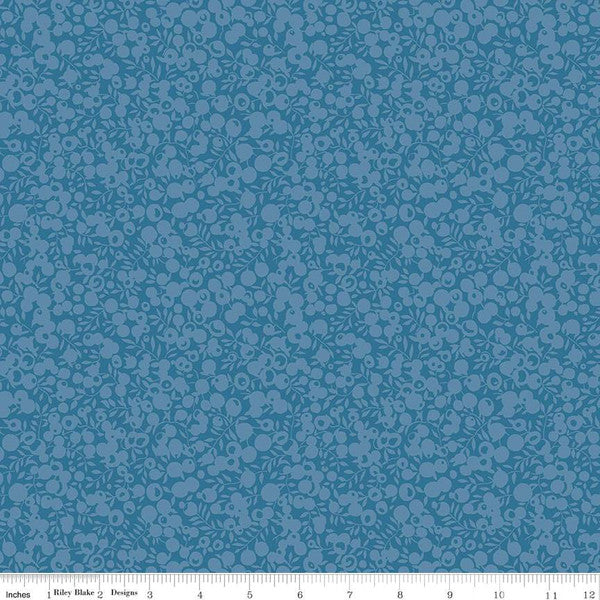 Quilting  fabric with a small all-over leaf and berry design in a dusted blue color, part of the Wiltshire Shadow collection by Liberty fabrics.