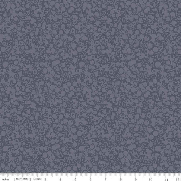 A close-up of a quilting fabric from the Liberty of London Wiltshire Shadow Blender Collection in a gray color, featuring a small all-over leaf and berry design.