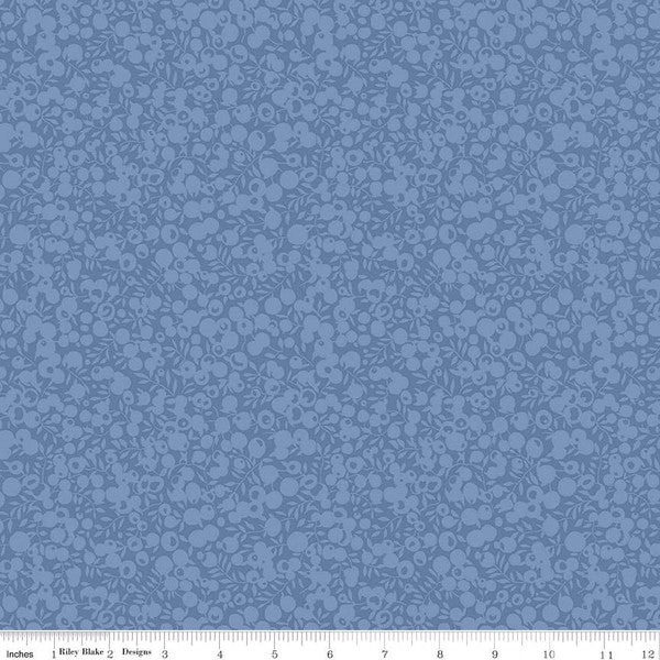 A quilting fabric with a small all-over leaf and berry design in a dusted denim color, part of the Wiltshire Shadow collection by Liberty fabrics.