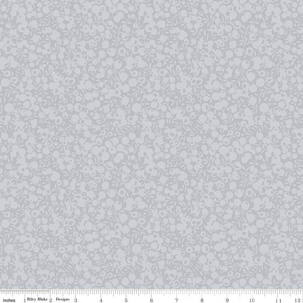 Quilting  fabric with a small all-over leaf and berry design in a dusted grey color, part of the Wiltshire Shadow collection by Liberty fabrics.