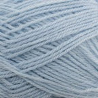 A swatch of baby blue-colored yarn from Naturally New Zealand in 3 ply / Light Fingering.