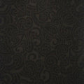 Quilt fabric featuring a traditional Maori Moko design in charcoal on black