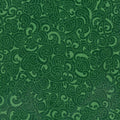 Quilt fabric featuring a traditional Maori Moko design in emerald tones