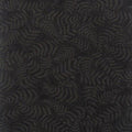 A quilting fabric featuring a charcoal fern print on a black background.