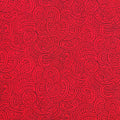 Quilt fabric featuring a traditional Maori Moko design in black on scarlet. 