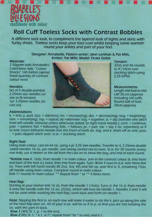 A leaflet for a knitting pattern titled 'Roll Cuff Toeless Socks with Contrast Bobbles' by Annabelle's Collections, detailing the sock design and materials required.