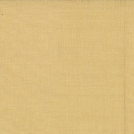 A solid yellow piece of fabric, for use as a blender for quilting, made of cotton material.